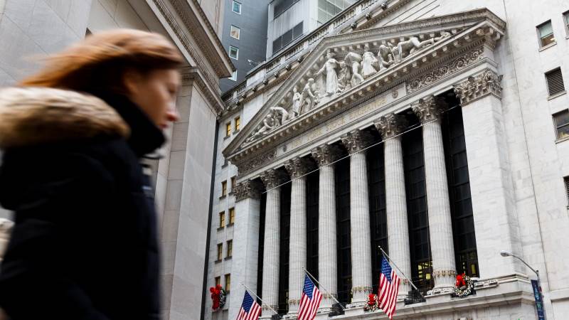 Wall Street closes mostly flat as shutdown nears record