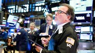 US mostly lower amid interest rate raise reports