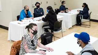 US jobless claims down by 26,000 to 360,000