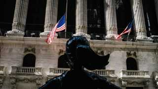 US opens lower to close out volatile week