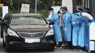 S. Korea’s daily virus cases at record-high 2,021