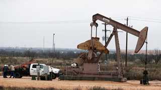 Oil cuts losses after upbeat US industrial data