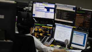 Asian markets mostly lower after data