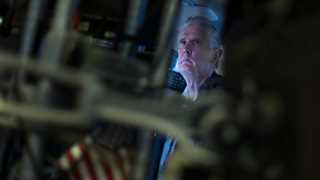 US opens flat to lower amid data, yield hike