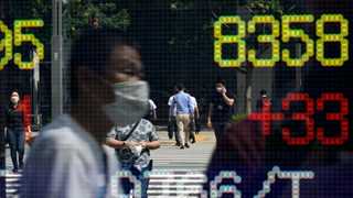 Nikkei tumbles 700 points as business activity falls