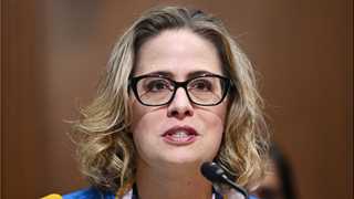 Sinema agrees to tax hike to pay for spending bill – report