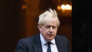 Johnson urges Britons to get COVID, flu shots