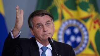 Brazil’s Senate calls for Bolsonaro to face charges over COVID