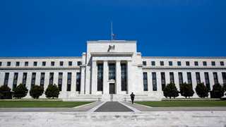 Fed holds interest rates, announces tapering