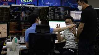 Asian markets mostly higher ahead of earnings