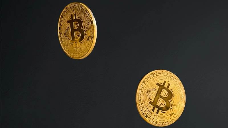 Bitcoin plunges 5%, Ether tumbles 6% amid Wall Street slump