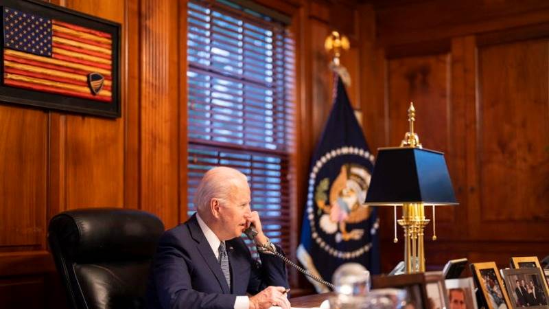 Biden says he repeated sanctions threat to Putin