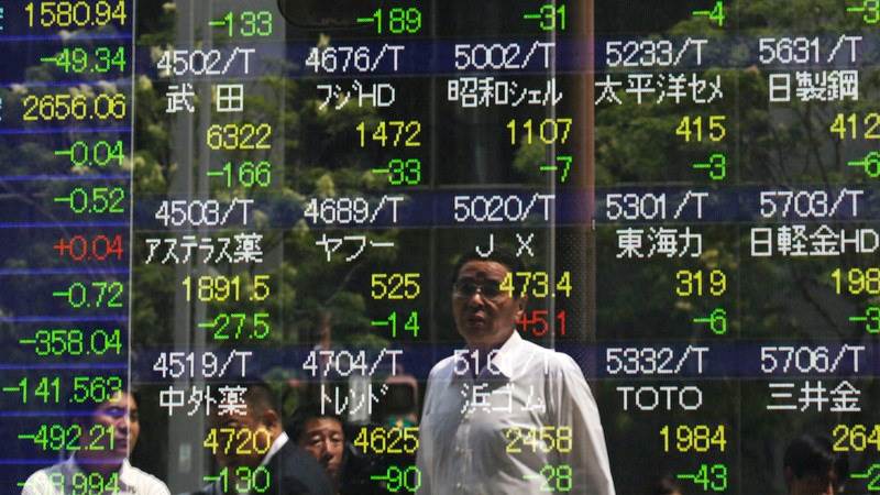 Asian stocks dip after economic data release