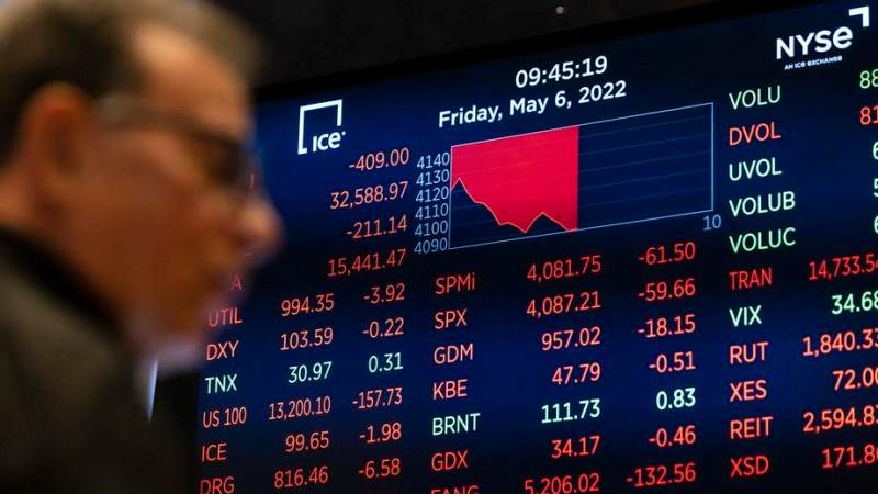 US markets open lower ahead of corporate earnings