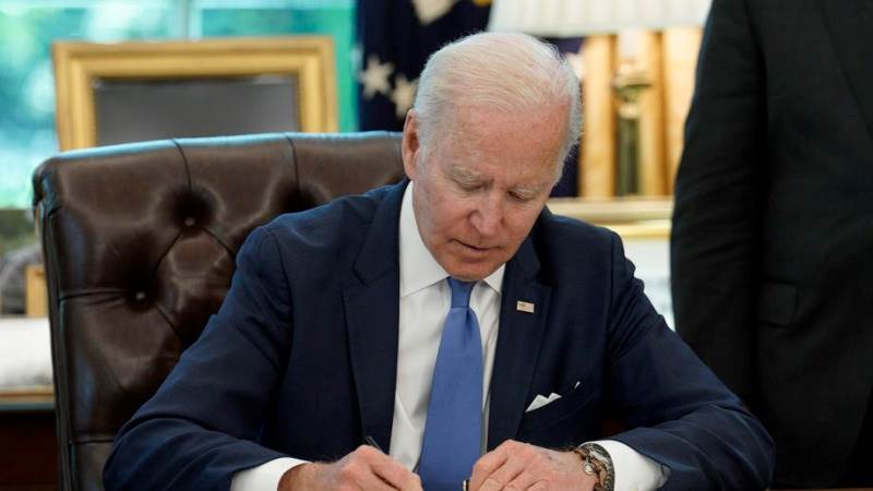 Biden signs Ukraine aid while in Seoul