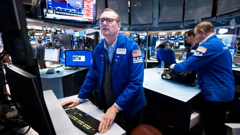 Wall Street sinks at open ahead of PMI data