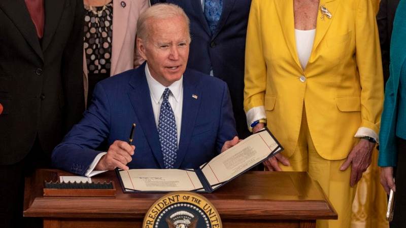 Biden signs shipping reform bill to ease inflation