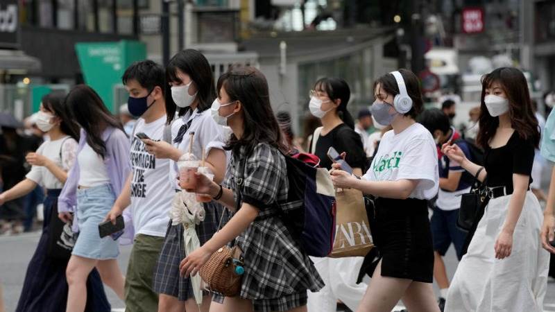 Japan to ease COVID measures despite surge in cases