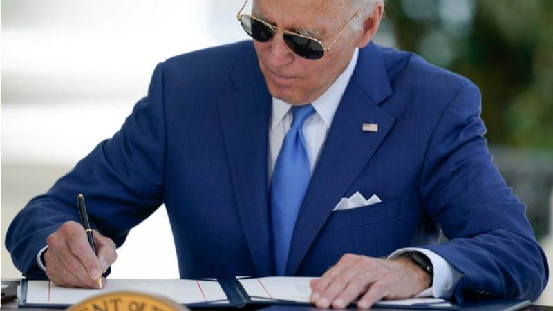 Biden signs into law Inflation Reduction Act