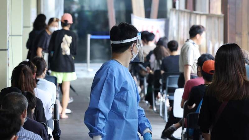 S. Korea’s daily COVID-19 cases drop under 50,000