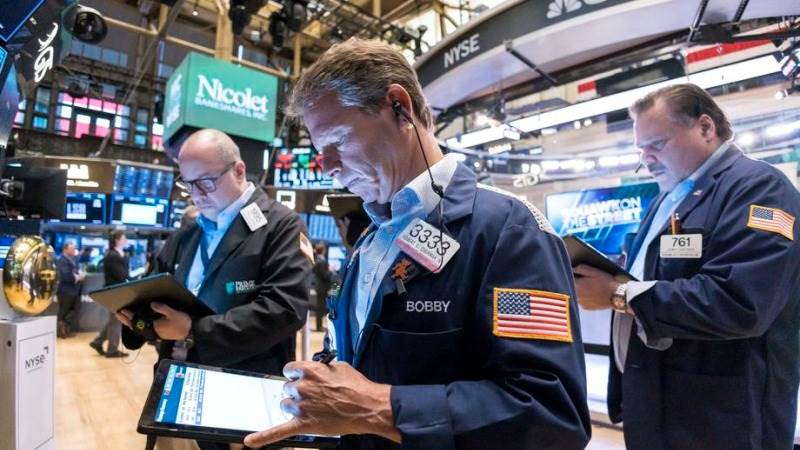 Wall Street closes lower after Powell’s hawkish remarks