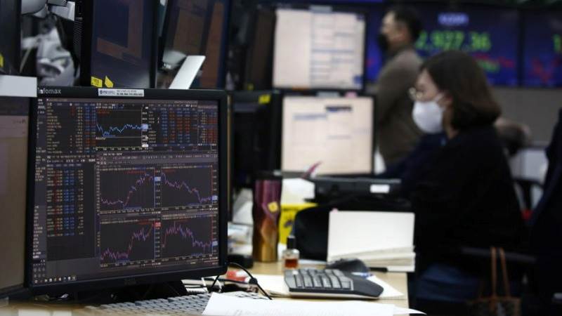 Asia trades higher amid earnings releases