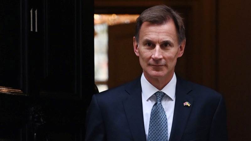 UK’s Hunt unveils broad tax rises, spending cuts