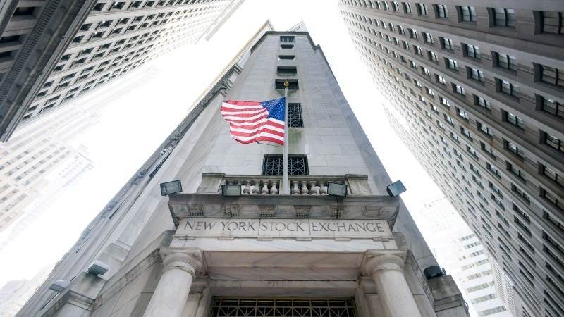 US closes mostly lower amid economic data, eyes on Powell