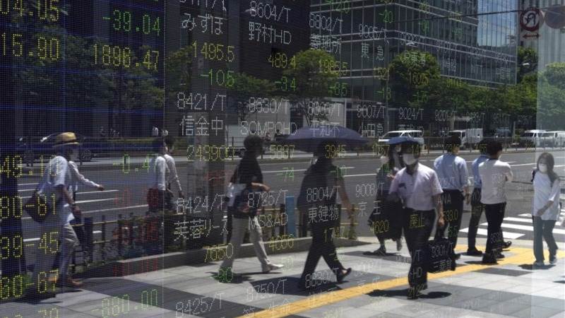 Asian markets jump after Powell signals slowing rate hikes