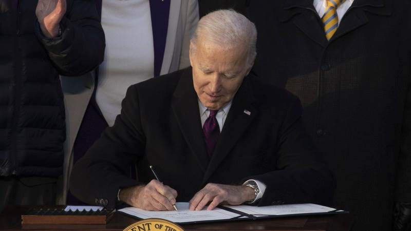 Biden signs record $858 billion defense bill