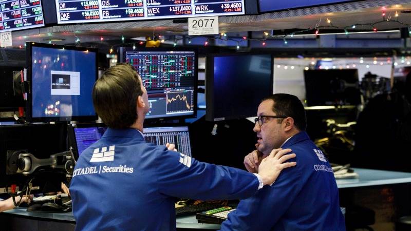 US opens mostly unchanged amid earnings