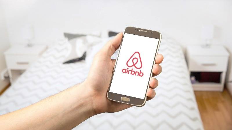 Airbnb rallies 14% as full-year revenue hits $8.4B