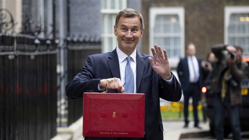 Hunt tells IMF UK economy will outperform forecasts