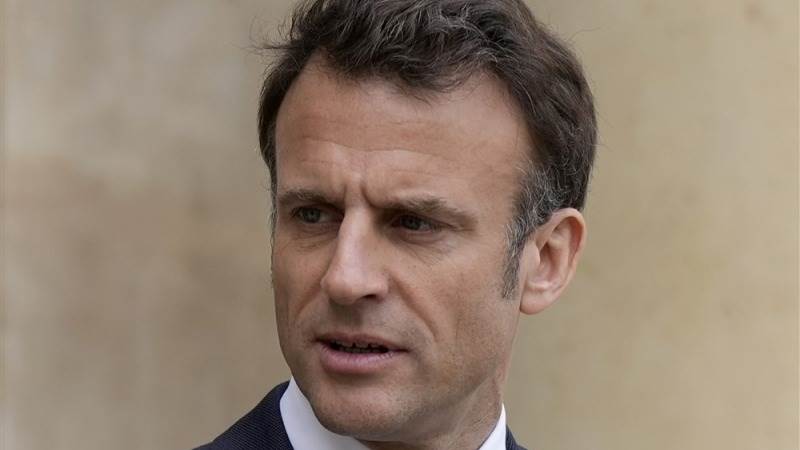 Macron signs pension reform into law