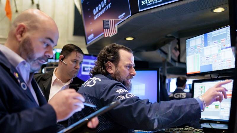 Wall Street opens lower amid corporate earnings