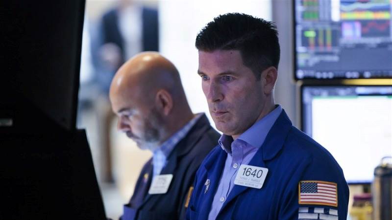 US declines at open as economy shows strength