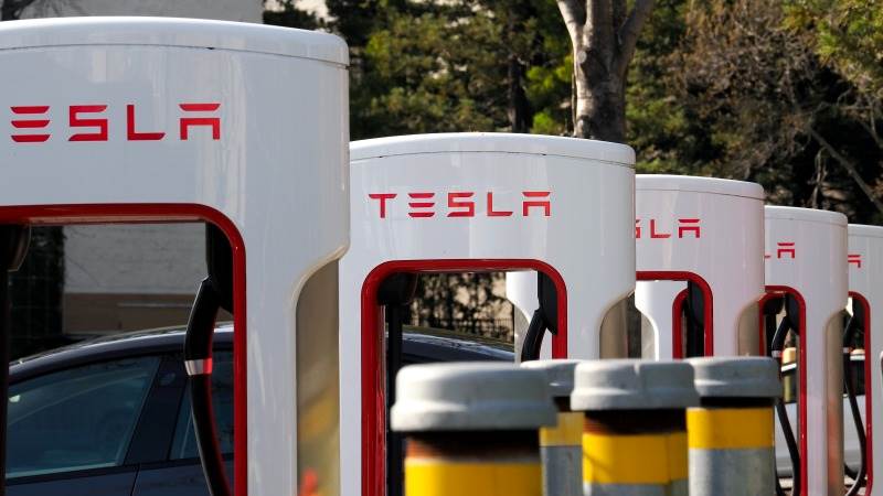 Tesla, GM jump premarket after EV charging stations deal