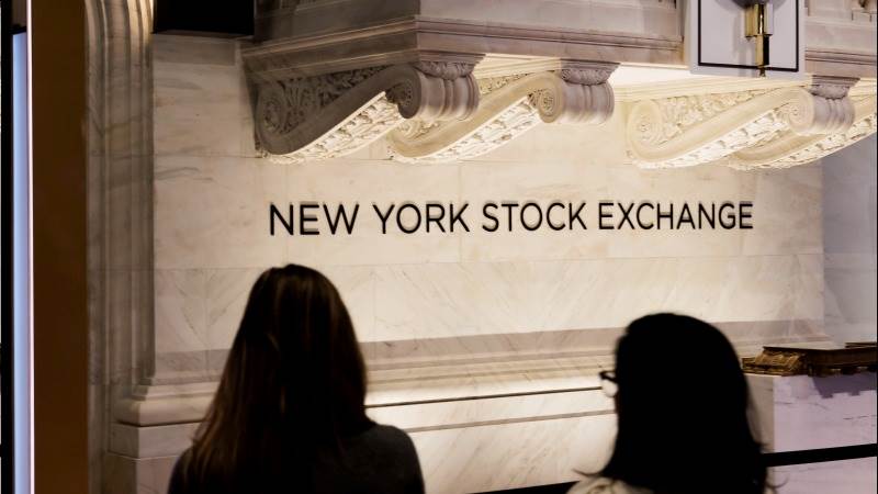 Wall Street opens higher as data pours in