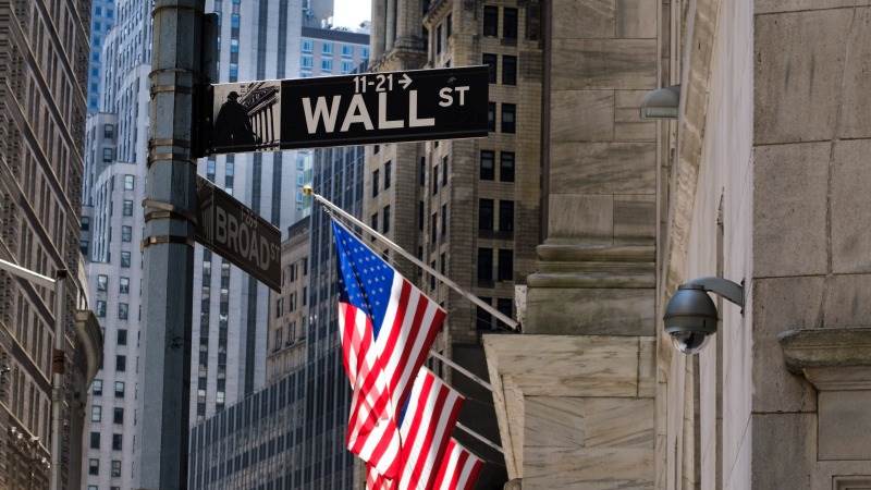 Wall Street opens mostly lower amid corporate news