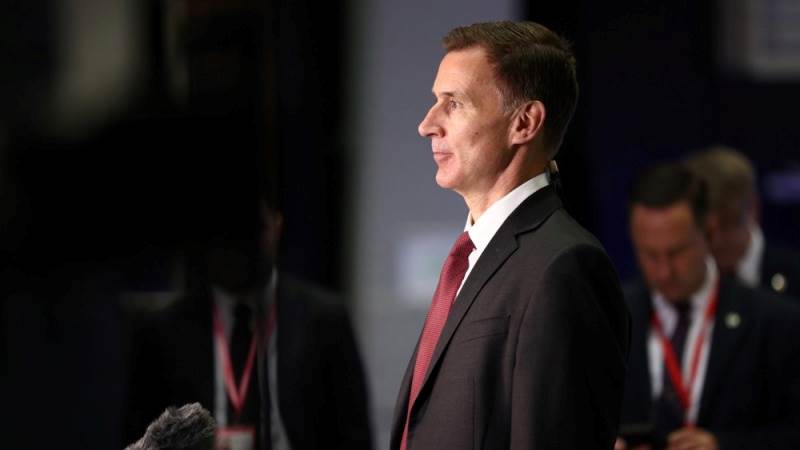 Hunt says UK will raise living wage to £11 per hour