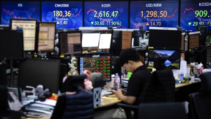 Asian shares mixed after economic data