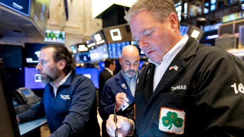 Wall Street opens mostly lower ahead of Powell remarks