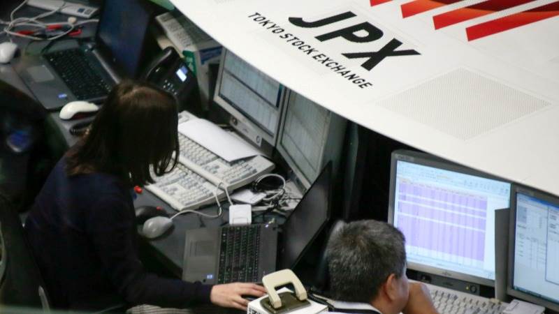 Asian stocks mostly down as regional tensions grow