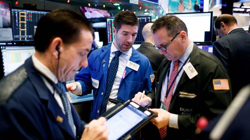 US opens higher amid earnings reports