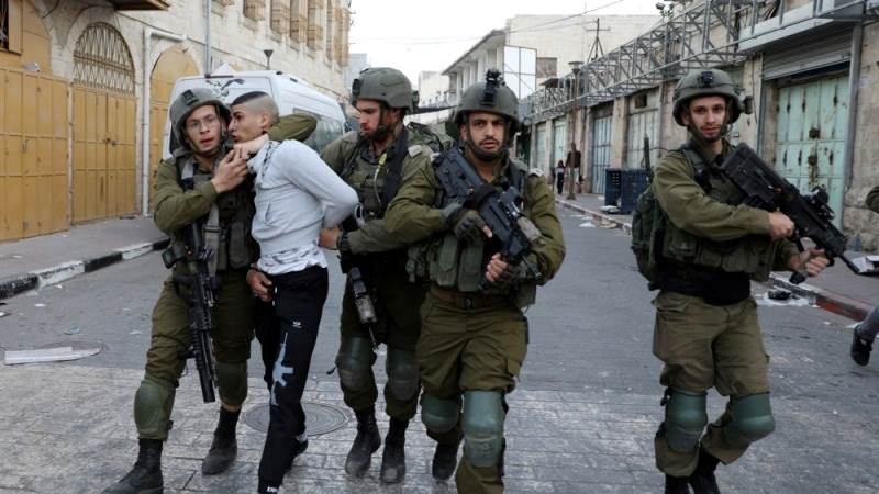 Israeli forces arrest dozens in West Bank raids