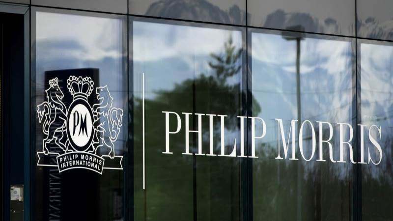 Philip Morris climbs 8%, hitting record high stock price