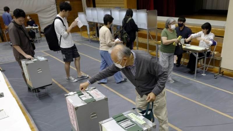 Japan’s ruling party projected to lose majority in snap election