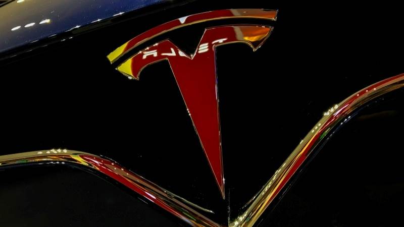 Tesla shares extend decline, slump 14%