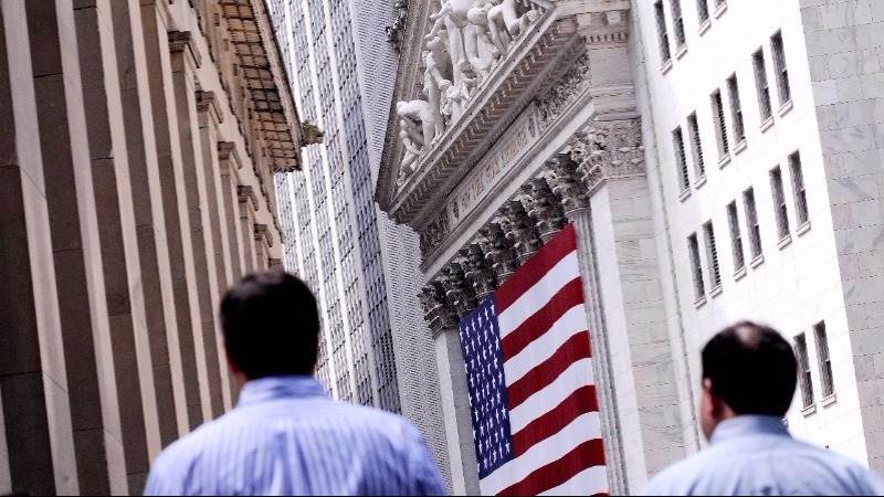 Wall Street settles flat to lower after OPEC deal