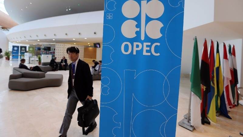 Crude extends OPEC deal rally as dollar edges lower